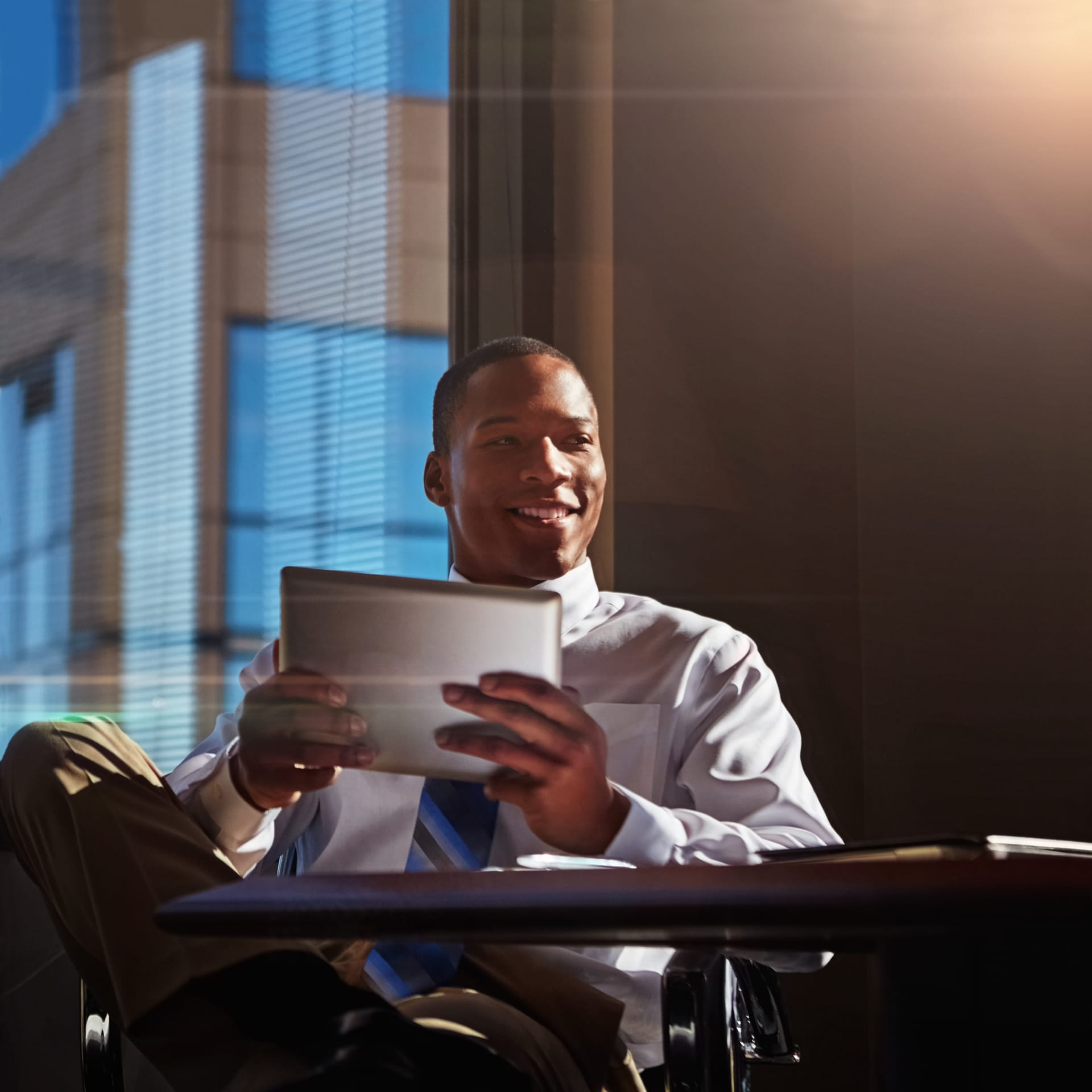 Professional smiling while reading a document